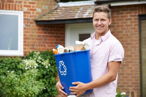 Staff using protective equipment during rubbish removal